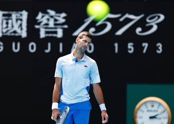 (240126) -- MELBOURNE, Jan. 26, 2024 -- Novak Djokovic of Serbia reacts during his men s singles semifinal against Jannik Sinner of Italy at Australian Open tennis tournament in Melbourne, Australia, Jan. 26, 2024. (Photo by Xinhua) (SP)AUSTRALIA-MELBOURNE-TENNIS-AUSTRALIAN OPEN-MEN S SINGLES SEMIFINALS ChuxChen 
