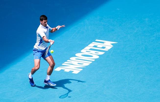 (240126) -- MELBOURNE, Jan. 26, 2024 -- Novak Djokovic of Serbia hits a return during his men s singles semifinal against Jannik Sinner of Italy at Australian Open tennis tournament in Melbourne, Australia, Jan. 26, 2024. ) (SP)AUSTRALIA-MELBOURNE-TENNIS-AUSTRALIAN OPEN-MEN S SINGLES SEMIFINALS MaxPing 