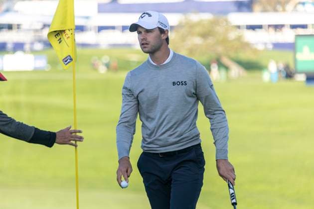LA JOLLA, CA - JANUARY 26: Thomas Detry picks up his ball after making birdie on the 16th hole during the third round of the PGA, Golf Herren Tour Farmer™s Insurance Open, at Torrey Pines Golf Course, Friday, January 26, 2024, in La Jolla, California. (Photo by Tony Ding Icon Sportswire) GOLF: JAN 26 PGA Farmers Insurance Open EDITORIAL USE ONLY Icon46520240126032