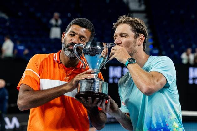 (240127) -- MELBOURNE, Jan. 27, 2024 -- Rohan Bopanna (L) Matthew Ebden pose for photos during the awarding ceremony after the men s doubles final between Rohan Bopanna (India) Matthew Ebden (Australia) and Simone Bolelli (Italy) Andrea Vavassori (Italy) at Australian Open tennis tournament in Melbourne, Australia, Jan. 27, 2024. ) (SP)AUSTRALIA-MELBOURNE-TENNIS-AUSTRALIAN OPEN-FINAL ChuxChen 