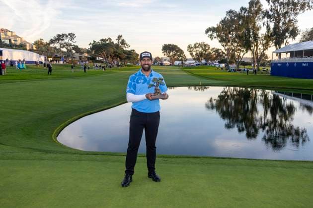 LA JOLLA, CA - JANUARY 27: Matthieu Pavon holds the championship trophy after the final round of the PGA, Golf Herren Tour Farmer™s Insurance Open, at Torrey Pines Golf Course, Saturday, January 27, 2024, in La Jolla, California. (Photo by Tony Ding Icon Sportswire) GOLF: JAN 27 PGA Farmers Insurance Open EDITORIAL USE ONLY Icon46520240127057