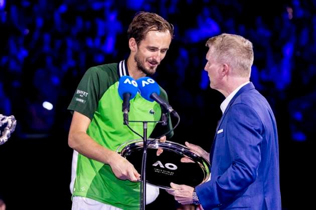 MELBOURNE, VIC - JANUARY 28: Daniil Medvedev of Russia receives his trophy as runner up from Jim Courier at the conclusion of thefinals of the 2024 Australian Open on January 28 2024, at Melbourne Park in Melbourne, Australia. (Photo by Jason Heidrich Icon Sportswire) TENNIS: JAN 28 Australian Open EDITORIAL USE ONLY Icon240128224