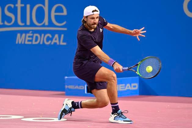 MONTPELLIER, FRANCE - JANUARY 30 : Lucas POUILLE (FRA) during the 1st round of the ATP, Tennis Herren 250 Open Sud de France tournament vs. Harold MAYOT (FRA) in Montpellier, France on January 30th, 2024. TENNIS : Open Sud de France ATP 250 - 30 01 2024 ValentinaClaret Panoramic 