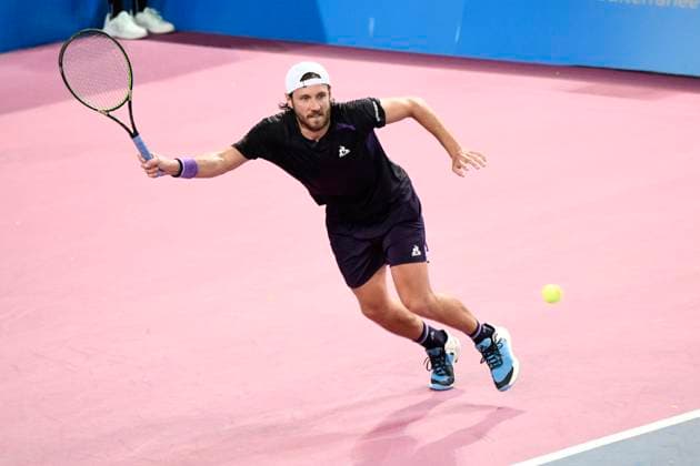 MONTPELLIER, FRANCE - JANUARY 30 : Lucas POUILLE (FRA) during the 1st round of the ATP, Tennis Herren 250 Open Sud de France tournament vs. Harold MAYOT (FRA) in Montpellier, France on January 30th, 2024. TENNIS : Open Sud de France ATP 250 - 30 01 2024 ValentinaClaret Panoramic 