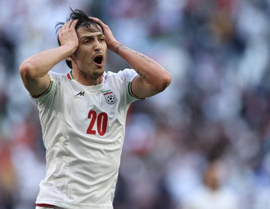 (240203) -- DOHA, Feb. 3, 2024 -- Iran s Sardar Azmoun (2nd L) reacts after his goal being disallowed during the quarterfinal match between Iran and Japan at AFC Asian Cup Qatar 2023 in Doha, Qatar, Feb. 3, 2024. ) (SP)QATAR-DOHA-FOOTBALL-AFC ASIAN CUP-IRAN VS JAPAN JiaxHaocheng 