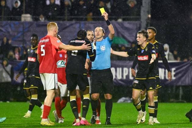 Ruddy Buquet ( referee ) shows a yellow card to Zaakaria Lako Lado Denis ( 6 - Monaco ) during the French Cup match between FC Rouen Metropole and AS Monaco at Stade Robert Diochon on February 08, 2024 in Rouen, France. ( Photo by federico pestellini panoramic ) - FOOTBALL : Rouen vs Monaco - Coupe de France - 08 02 2024 FedericoPestellini Panoramic 