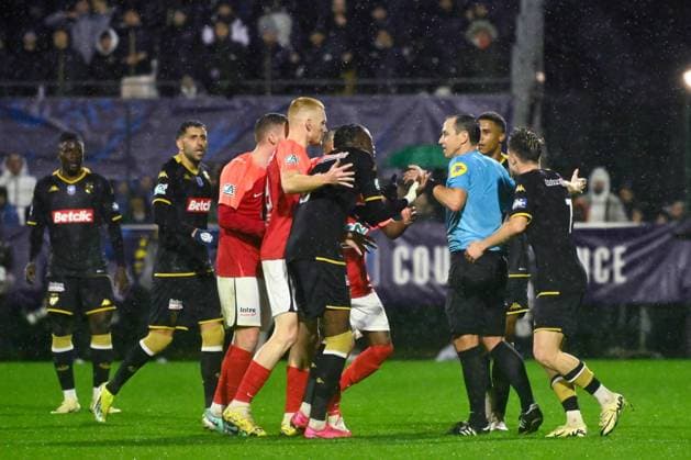 Ruddy Buquet ( referee ) shows a yellow card to Zaakaria Lako Lado Denis ( 6 - Monaco ) during the French Cup match between FC Rouen Metropole and AS Monaco at Stade Robert Diochon on February 08, 2024 in Rouen, France. ( Photo by federico pestellini panoramic ) - FOOTBALL : Rouen vs Monaco - Coupe de France - 08 02 2024 FedericoPestellini Panoramic 