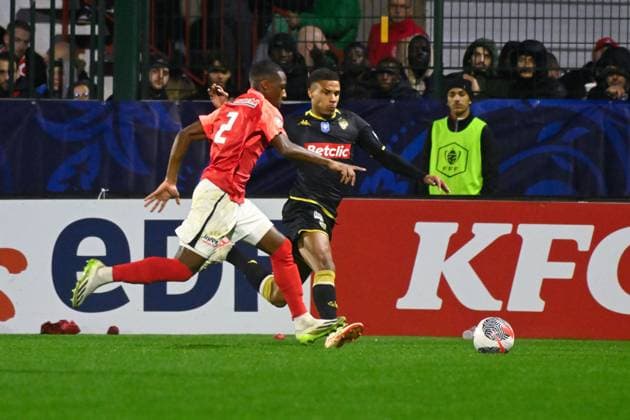 Jakobs Ismail ( 11 - Monaco ) and Sy Lamine ( 2 - Rouen ) during the French Cup match between FC Rouen Metropole and AS Monaco at Stade Robert Diochon on February 08, 2024 in Rouen, France. ( Photo by federico pestellini panoramic ) - FOOTBALL : Rouen vs Monaco - Coupe de France - 08 02 2024 FedericoPestellini Panoramic 