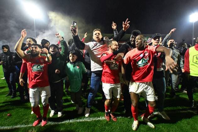 Rouen players celebrate their side s victory after during the French Cup match between FC Rouen Metropole and AS Monaco at Stade Robert Diochon on February 08, 2024 in Rouen, France. ( Photo by federico pestellini panoramic ) - FOOTBALL : Rouen vs Monaco - Coupe de France - 08 02 2024 FedericoPestellini Panoramic 