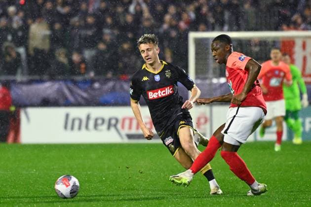 Aleksandr Golovin ( 7 - Monaco ) and Sy Lamine ( 2 - Rouen ) during the French Cup match between Quevilly Rouen Metropole and AS Monaco at Stade Robert Diochon on February 08, 2024 in Rouen, France. ( Photo by federico pestellini panoramic ) - FOOTBALL : Rouen vs Monaco - Coupe de France - 08 02 2024 FedericoPestellini Panoramic 