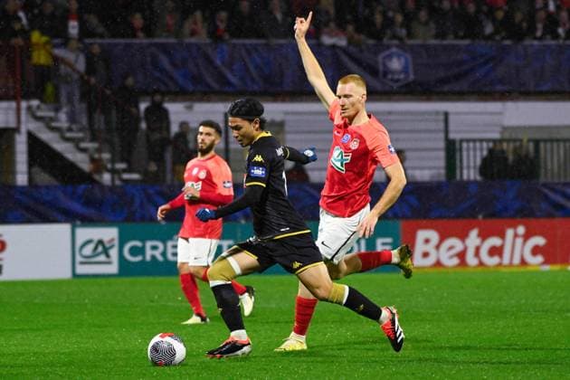 Minamino Takumi ( 10 - Monaco ) and Sanson Valentin ( 5 - Rouen ) during the French Cup match between Quevilly Rouen Metropole and AS Monaco at Stade Robert Diochon on February 08, 2024 in Rouen, France. ( Photo by federico pestellini panoramic ) - FOOTBALL : Rouen vs Monaco - Coupe de France - 08 02 2024 FedericoPestellini Panoramic 