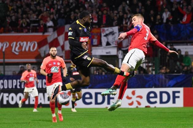Fofana Youssouf ( 8 - Monaco ) and Bassin Clement ( 3 - Rouen ) during the French Cup match between FC Rouen Metropole and AS Monaco at Stade Robert Diochon on February 08, 2024 in Rouen, France. ( Photo by federico pestellini panoramic ) - FOOTBALL : Rouen vs Monaco - Coupe de France - 08 02 2024 FedericoPestellini Panoramic 