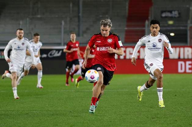 09.02.2024, xavx, Fussball 2.Bundesliga, SV Wehen Wiesbaden - 1.FC Nürnberg emspor, v.l. Thijmen Goppel (SV Wehen Wiesbaden), Nathaniel Brown (1.FC Nürnberg) (DFL DFB REGULATIONS PROHIBIT ANY USE OF PHOTOGRAPHS as IMAGE SEQUENCES and or QUASI-VIDEO) Wiesbaden