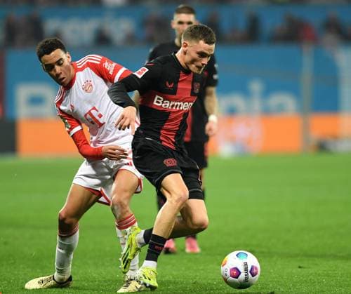 10.02.2024, Leverkusen, Germany, BayArena, Bayer Leverkusen vs FC Bayern Muenchen - 1. Bundesliga, Jamal Musiala (FC Bayern Muenchen) und Florian Wirtz (Bayer 04 Leverkusen) im Zweikampf (Foto Ralf Treese) DFB DFL REGULATIONS PROHIBIT ANY USE OF PHOTOGRAPHS AS IMAGE SEQUENCES AND OR QUASI-VIDEO. Leverkusen BayArena North Rhine-Westphalia Germany