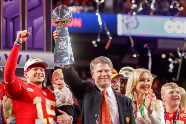 Kansas City Chiefs owner Clark Hunt hoists the Vince Lombardi Trophy while quarterback Patrick Mahomes (15) cheers after defeating the San Francisco 49ers 25-22 in Super Bowl LVIII at Allegiant Stadium in Las Vegas, Nevada, on Sunday, February 11, 2024.  SBP20240211208 JohnxAngelillo