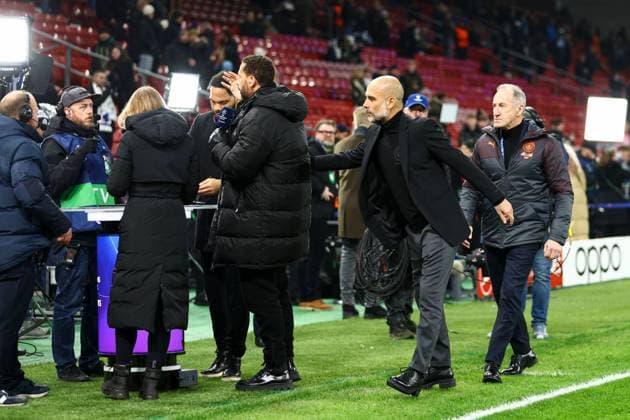Manchester City manager Pep Guardiola greets TNT Sports pundits FC Copenhagen v Manchester City, UEFA Champions League, Round of 16, First Leg, Football, Parken Stadium, Copenhagen, Denmark - 13 Feb 2024 EDITORIAL USE ONLY No use with unauthorised audio, video, data, fixture lists, club league logos or live services. Online in-match use limited to 120 images, no video emulation. No use in betting, games or single club league player publications.  Copyright: xKieranxMcManus Shutterstockx 14343227h