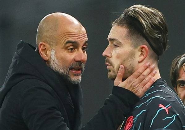 Manchester City manager Pep Guardiola speaks with a dejected Jack Grealish of Manchester City on the sideline FC Copenhagen v Manchester City, UEFA Champions League, Round of 16, First Leg, Football, Parken Stadium, Copenhagen, Denmark - 13 Feb 2024 EDITORIAL USE ONLY No use with unauthorised audio, video, data, fixture lists, club league logos or live services. Online in-match use limited to 120 images, no video emulation. No use in betting, games or single club league player publications.  Copyright: xKieranxMcManus Shutterstockx 14343227aq