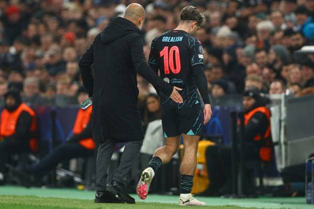 Jack Grealish of Manchester City leaves the pitch after an injury and is consoled by Manchester City manager Pep Guardiola FC Copenhagen v Manchester City, UEFA Champions League, Round of 16, First Leg, Football, Parken Stadium, Copenhagen, Denmark - 13 Feb 2024 EDITORIAL USE ONLY No use with unauthorised audio, video, data, fixture lists, club league logos or live services. Online in-match use limited to 120 images, no video emulation. No use in betting, games or single club league player publications.  Copyright: xKieranxMcManus Shutterstockx 14343227av