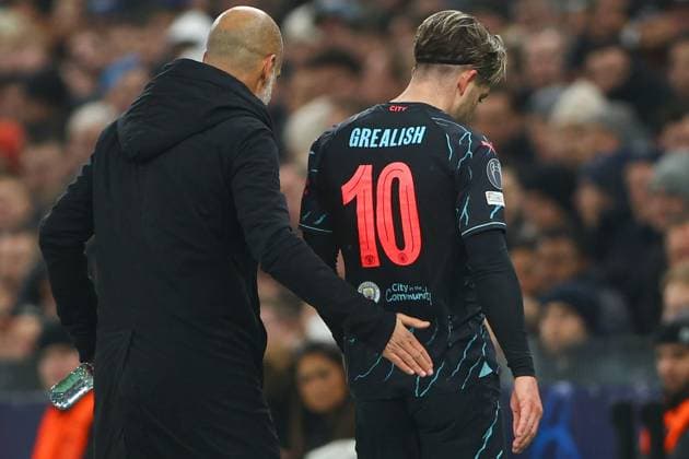 Jack Grealish of Manchester City leaves the pitch after an injury and is consoled by Manchester City manager Pep Guardiola FC Copenhagen v Manchester City, UEFA Champions League, Round of 16, First Leg, Football, Parken Stadium, Copenhagen, Denmark - 13 Feb 2024 EDITORIAL USE ONLY No use with unauthorised audio, video, data, fixture lists, club league logos or live services. Online in-match use limited to 120 images, no video emulation. No use in betting, games or single club league player publications.  Copyright: xKieranxMcManus Shutterstockx 14343227aw