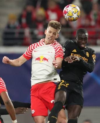 13.02.2024, xtgx, Fussball UEFA Champions League 1 8 Finale, RB Leipzig - Real Madrid emspor, v.l. Daniel Olmo (RB Leipzig), Ferland Mendy (Real Madrid) (DFL DFB REGULATIONS PROHIBIT ANY USE OF PHOTOGRAPHS as IMAGE SEQUENCES and or QUASI-VIDEO) Leipzig