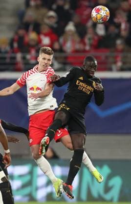 13.02.2024, xtgx, Fussball UEFA Champions League 1 8 Finale, RB Leipzig - Real Madrid emspor, v.l. Daniel Olmo (RB Leipzig), Ferland Mendy (Real Madrid) (DFL DFB REGULATIONS PROHIBIT ANY USE OF PHOTOGRAPHS as IMAGE SEQUENCES and or QUASI-VIDEO) Leipzig