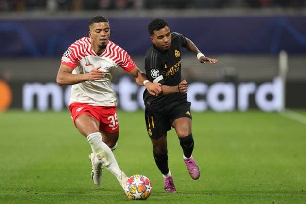 13.02.2024, xtgx, Fussball UEFA Champions League 1 8 Finale, RB Leipzig - Real Madrid emspor, v.l. Benjamin Henrichs (RB Leipzig), Rodrygo (Real Madrid) (DFL DFB REGULATIONS PROHIBIT ANY USE OF PHOTOGRAPHS as IMAGE SEQUENCES and or QUASI-VIDEO) Leipzig