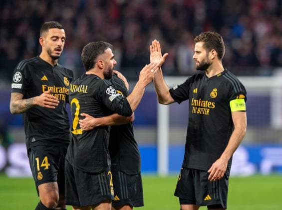 Fussball, Herren, Saison 2023 2024, UEFA Champions League (Achtelfinale, Hinspiel), RB Leipzig - Real Madrid, v. l. Joselu, Dani Carvajal, Nacho (alle Madrid), Jubel nach dem Abpfiff, 13.02. 2024, Copyright: xSebastianxRäppold MatthiasxKochx