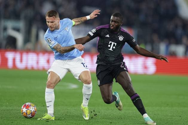 UEFA Champions League SS Lazio vs Bayern Munich Lazio™s Italian forward Ciro Immobile challenges for the ball with Bayern Munich s French defender Dayot Upamecano during the UEFA Champions League Round of 16, first-leg football match between SS Lazio vs Bayern Munich in Rome, on February 14, 2024. ABPH6325 Copyright: xAntonioxBalascox