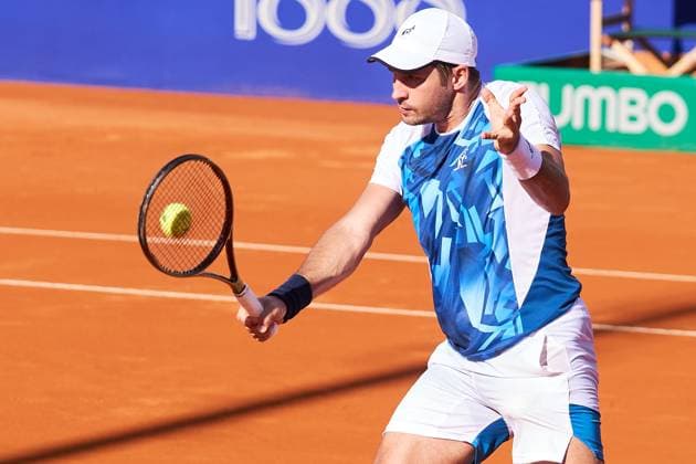 Dusan Lajovic of Serbia returns a backhand to Alejandro Tabilo of Chile during their second round match of the IEB+ Argentina Open 2024 at Buenos Aires Lawn Tennis Club on February 14, 2024 in Buenos Aires, Argentina. (Photo by Camilla Stolen Imago) Buenos Aires Argentina Copyright: xCamillaxStolenx L1720074 1