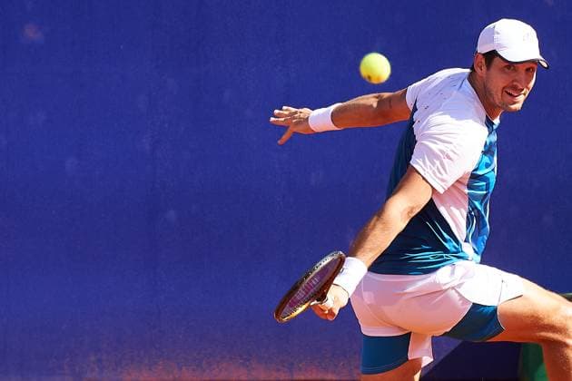 Dusan Lajovic of Serbia returns a backhand to Alejandro Tabilo of Chile during their second round match of the IEB+ Argentina Open 2024 at Buenos Aires Lawn Tennis Club on February 14, 2024 in Buenos Aires, Argentina. (Photo by Camilla Stolen Imago) Buenos Aires Argentina Copyright: xCamillaxStolenx L1710643