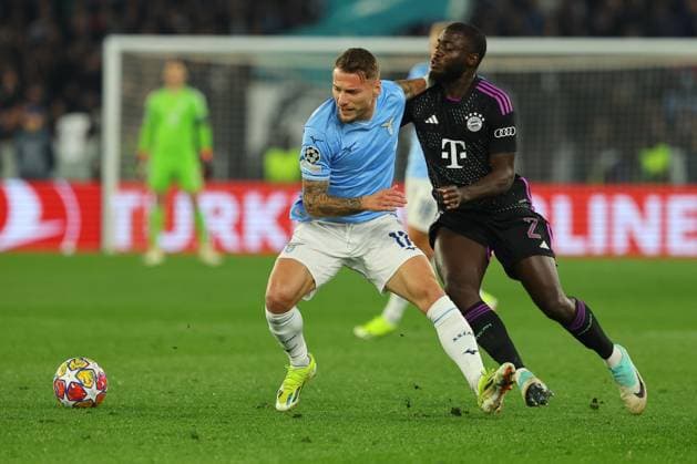 Rome, Italy 14.2.2024: Ciro Immobile of Lazio fight for the ball with Dayot Upamecano of Bayern Munchen in action during the Uefa Champions League 2023-2024, round of 16 football match SS Lazio vs FC Bayern Mucnhen at Olympic Stadium in Rome.  Copyright: xMarcoxIacobucci IPAxSportx xipa-x xx IPA_43441498 IPA_Agency_IPA43441498