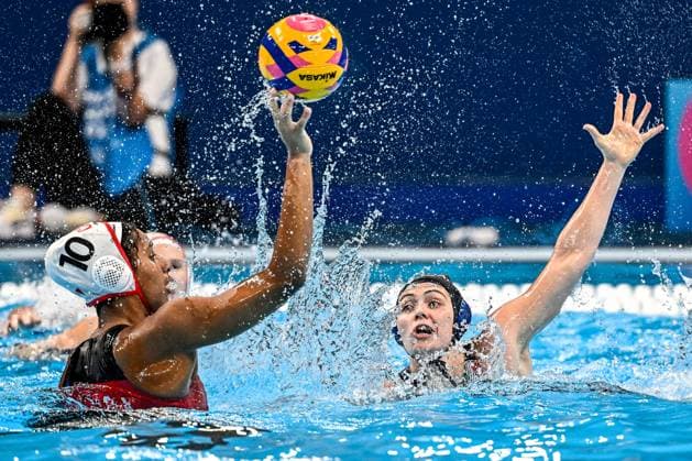 Serena Browne of Canada and Lucrezia Lys Cergol of Italy during the Water polo, Wasserball women classification 7th 8th place match between team Canada (white caps) and team Italy (blue caps) of the 21st World Aquatics Championships at the Aspire Dome in Doha (Qatar), February 16, 2024. GiorgioXScala