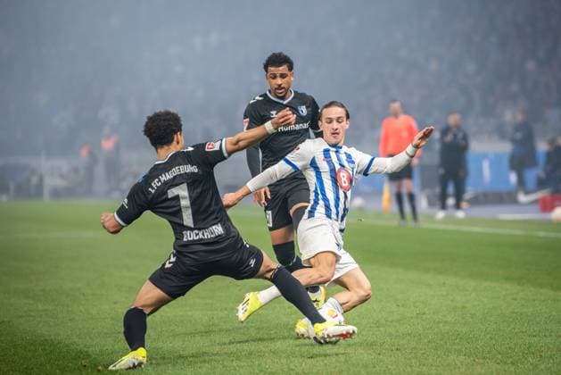 2. Fußball Bundesliga, Hertha BSC vs 1. FC Magdeburg. Berlin, 16.02.2024 Herbert Bockhorn (1. FC Magdeburg, 7), Xavier Amaechi (1. FC Magdeburg, 20), Michal Karbownik (Hertha BSC, 6) 2. Fußball Bundesliga, Hertha BSC vs 1. FC Magdeburg, Olympiastadion, Berlin, 16.02.2024 DFL REGULATIONS PROHIBIT ANY USE OF PHOTOGRAPHS AS IMAGE SEQUENCES AND OR QUASI-VIDEO.