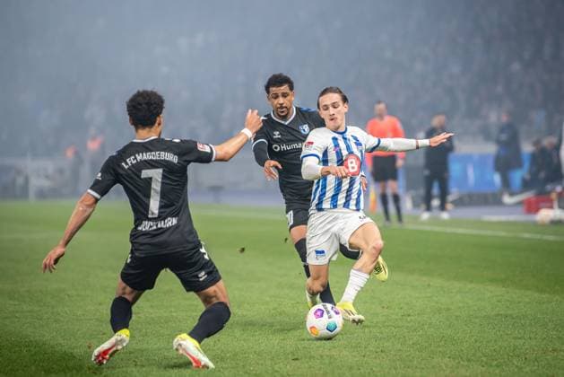 2. Fußball Bundesliga, Hertha BSC vs 1. FC Magdeburg. Berlin, 16.02.2024 Herbert Bockhorn (1. FC Magdeburg, 7), Xavier Amaechi (1. FC Magdeburg, 20), Michal Karbownik (Hertha BSC, 6) 2. Fußball Bundesliga, Hertha BSC vs 1. FC Magdeburg, Olympiastadion, Berlin, 16.02.2024 DFL REGULATIONS PROHIBIT ANY USE OF PHOTOGRAPHS AS IMAGE SEQUENCES AND OR QUASI-VIDEO.