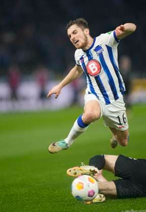 Germany, Berlin, 16.02.2024, Olympic Stadium, Hertha BSC vs 1.FC Magdeburg - 2. Bundesliga, Jonjoe Kenny (Hertha BSC) and Jean Hugonet (1.FC Magdeburg) battle for the ball Berlin Olympic Stadium Berlin Germany