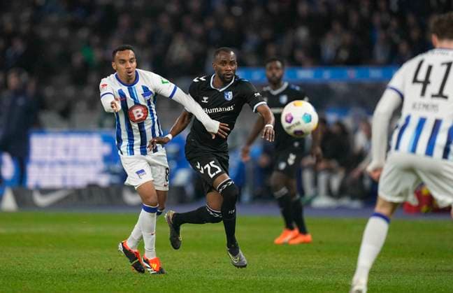 Germany, Berlin, 16.02.2024, Olympic Stadium, Hertha BSC vs 1.FC Magdeburg - 2. Bundesliga, Bilal Hussein (Hertha BSC) and Silas Gnaka (1.FC Magdeburg) battle for the ball Berlin Olympic Stadium Berlin Germany