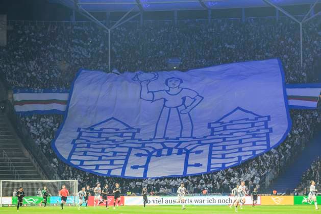 Fahne des FCM in der Fankurve, Zuschauertribuene, Hertha BSC - 1. FC Magdeburg, 2. Bundesliga, Fussball, DFB, Spielzeit 2023 2024, 22. Spieltag, Olympia - Stadion Berlin, DFB DFL REGULATIONS PROHIBIT ANY USE OF PHOTOGRAPHS AS IMAGE SEQUENCES AND OR QUASI-VIDEO, 16.02. 2024, Foto: HMB Media Uwe Koch