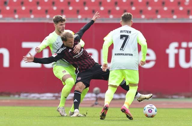 18.02.2024 - Fussball - Saison 2023 2024 - 2. Fussball - Bundesliga - 22. Spieltag: 1. FC Nürnberg FCN ( Club ) - 1. FC Kaiserslautern FCK ( Roten Teufel ) - Sportfoto Zink DaMa - xdaxmax - DFL regulations prohibit any use of photographs as image sequences and or quasi-video - only for editorial use - Jan Elvedi (33, 1. FC Kaiserslautern FCK ) Sebastian Andersson (20, 1. FC Nürnberg FCN ) Marlon Ritter (7, 1. FC Kaiserslautern FCK )