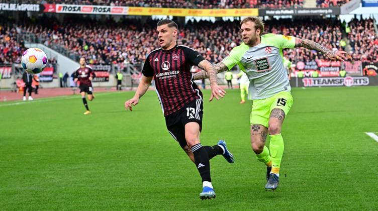 18.02.2024 - Fussball - Saison 2023 2024 - 2. Fussball - Bundesliga - 22. Spieltag: 1. FC Nürnberg FCN ( Club ) - 1. FC Kaiserslautern FCK ( Roten Teufel ) - Sportfoto Zink - xwoxzix - DFL regulations prohibit any use of photographs as image sequences and or quasi-video - only for editorial use - Erik Wekesser (13, 1. FC Nürnberg FCN ) Tymoteusz Puchacz (15, 1. FC Kaiserslautern FCK )