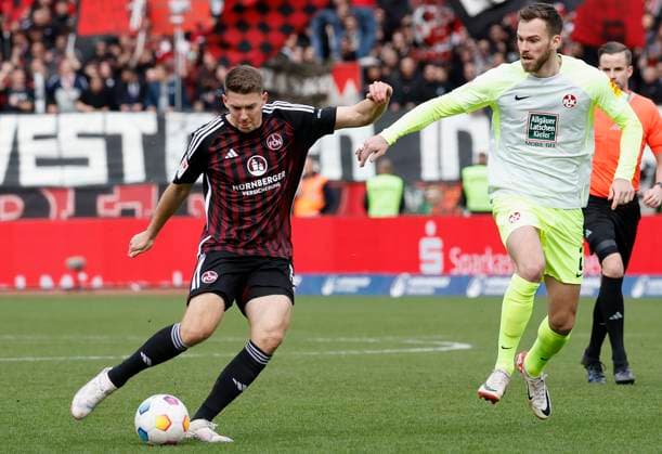 Bild: v. li. Florian Flick (1.FC Nuernberg, 6) und Boris Tomiak (1.FC Kaiserslautern, 2). 18.02.2024, Fussball, 2. Bundesliga, 1. FC Nuernberg - 1. FC Kaiserslautern, GER, Nuernberg, Max-Morlock-Stadion DFL REGULATIONS PROHIBIT ANY USE OF PHOTOGRAPHS AS IMAGE SEQUENCES AND OR QUASI-VIDEO.