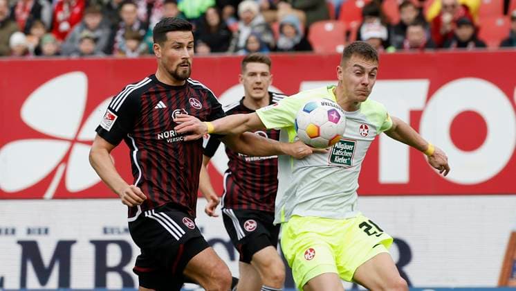 Bild: v. li. Ahmet Guerleyen (1.FC Nuernberg, 3) und Filip Kaloc (1.FC Kaiserslautern, 26). 18.02.2024, Fussball, 2. Bundesliga, 1. FC Nuernberg - 1. FC Kaiserslautern, GER, Nuernberg, Max-Morlock-Stadion DFL REGULATIONS PROHIBIT ANY USE OF PHOTOGRAPHS AS IMAGE SEQUENCES AND OR QUASI-VIDEO.