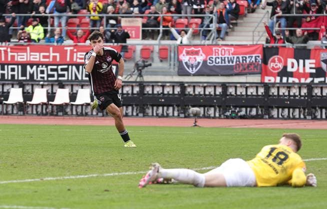 18.02.2024 - Fussball - Saison 2023 2024 - 2. Fussball - Bundesliga - 22. Spieltag: 1. FC Nürnberg FCN ( Club ) - 1. FC Kaiserslautern FCK ( Roten Teufel ) - Sportfoto Zink DaMa - xdaxmax - DFL regulations prohibit any use of photographs as image sequences and or quasi-video - only for editorial use - Jubel Freude Torjubel nach Tor zum 1:1 - Can Yilmaz Uzun (42, 1. FC Nürnberg FCN ) jubelt freut sich - Torschütze: Can Yilmaz Uzun (42, 1. FC Nürnberg FCN )
