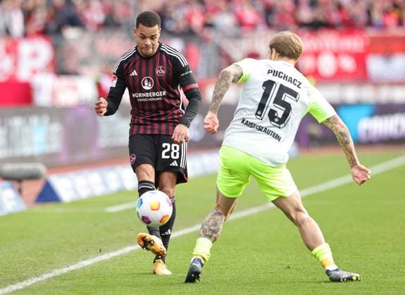 18.02.2024 - Fussball - Saison 2023 2024 - 2. Fussball - Bundesliga - 22. Spieltag: 1. FC Nürnberg FCN ( Club ) - 1. FC Kaiserslautern FCK ( Roten Teufel ) - Sportfoto Zink DaMa - xdaxmax - DFL regulations prohibit any use of photographs as image sequences and or quasi-video - only for editorial use - Jan Gyamerah (28, 1. FC Nürnberg FCN ) Tymoteusz Puchacz (15, 1. FC Kaiserslautern FCK )