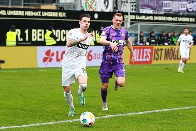 18.02.2024, xrhsx, Fussball 2.Bundesliga, SV Elversberg - VfL Osnabrück emspor, v.l. Hugo Vandermersch (SV Elversberg) Thomas Goiginger (VfL Osnabrueck Osnabrück) Zweikampf, Aktion, action, battle for the ball (DFL DFB REGULATIONS PROHIBIT ANY USE OF PHOTOGRAPHS as IMAGE SEQUENCES and or QUASI-VIDEO) Elversberg