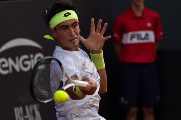 (240220) -- RIO DE JANEIRO, Feb. 20, 2024 -- Francisco Comesana of Argentina hits a return during the round 32 match against Francisco Cerundolo of Argentina at the 2024 ATP500 Rio Open at Jockey Club Brasileiro in Rio de Janeiro, Brazil, Feb. 19, 2024. ) (SP)BRAZIL-RIO DE JANEIRO-TENNIS-ATP500-RIO OPEN WangxTiancong 