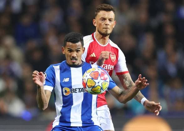Porto, Portugal, 21st February 2024. Galeno of FC Porto with Ben White of Arsenal during the UEFA Champions League match at the Estadio do Dragao, Porto. Picture credit should read: David Klein Sportimage EDITORIAL USE ONLY. No use with unauthorised audio, video, data, fixture lists, club league logos or live services. Online in-match use limited to 120 images, no video emulation. No use in betting, games or single club league player publications. SPI-2957-0025