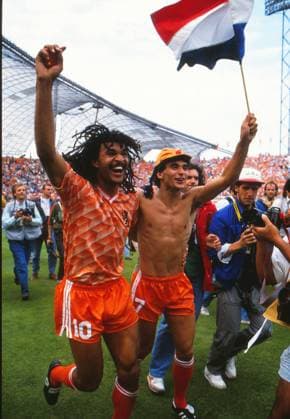 Football - UEFA EURO, EM, Europameisterschaft,Fussball 1988 European Championship, EM, Europameisterschaft Final - Soviet Union 0 Netherlands 2 Holland captain Ruud Gullit (left) celebrates with teammate Gerald Vanenburg after victory at the Olympiastadion, Munich, West Germany. 25 06 1988 
