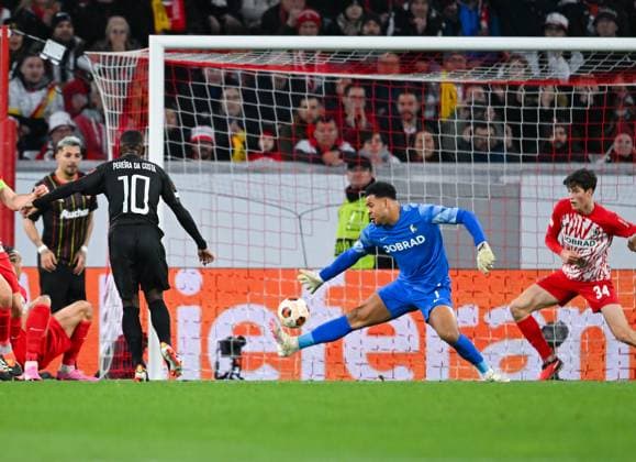 Germany, Freiburg, 22.02.2024, Europa-Park Stadion, SC Freiburg vs RC Lens - UEFA Europa League, David Costa (RC Lens) scores against Noah Atubolu (SC Freiburg) the first goal for his team Freiburg Europa-Park Stadion Baden-Wuerttemberg Germany