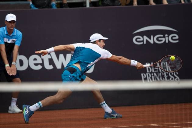 (240223) -- RIO DE JANEIRO, Feb. 23, 2024 -- Dusan Lajovic of Serbia hits a return during the round 16 match against Laslo Djere of Serbia at the 2024 ATP500 Rio Open at Jockey Club Brasileiro in Rio de Janeiro, Brazil, Feb. 22, 2024. ) (SP)BRAZIL-RIO DE JANEIRO-TENNIS-ATP500-RIO OPEN WangxTiancong 