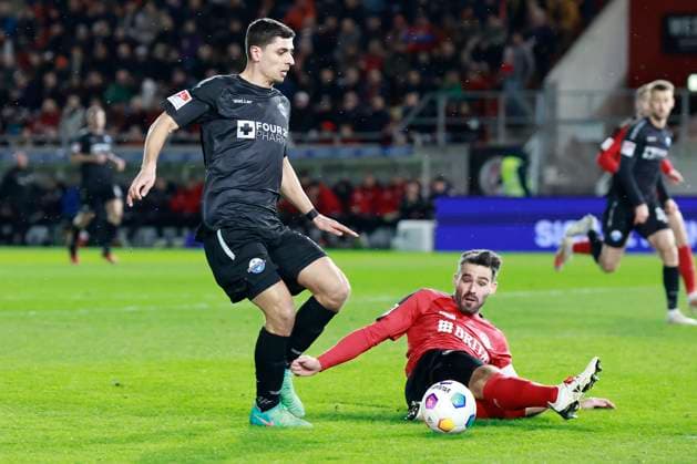 23.02.2024, xavx, Fussball 2.Bundesliga, SV Wehen Wiesbaden - SC Paderborn 07 emspor, v.l. Koen Kostons (SC Paderborn 07), Sascha Mockenhaupt (SV Wehen Wiesbaden) (DFL DFB REGULATIONS PROHIBIT ANY USE OF PHOTOGRAPHS as IMAGE SEQUENCES and or QUASI-VIDEO) Wiesbaden